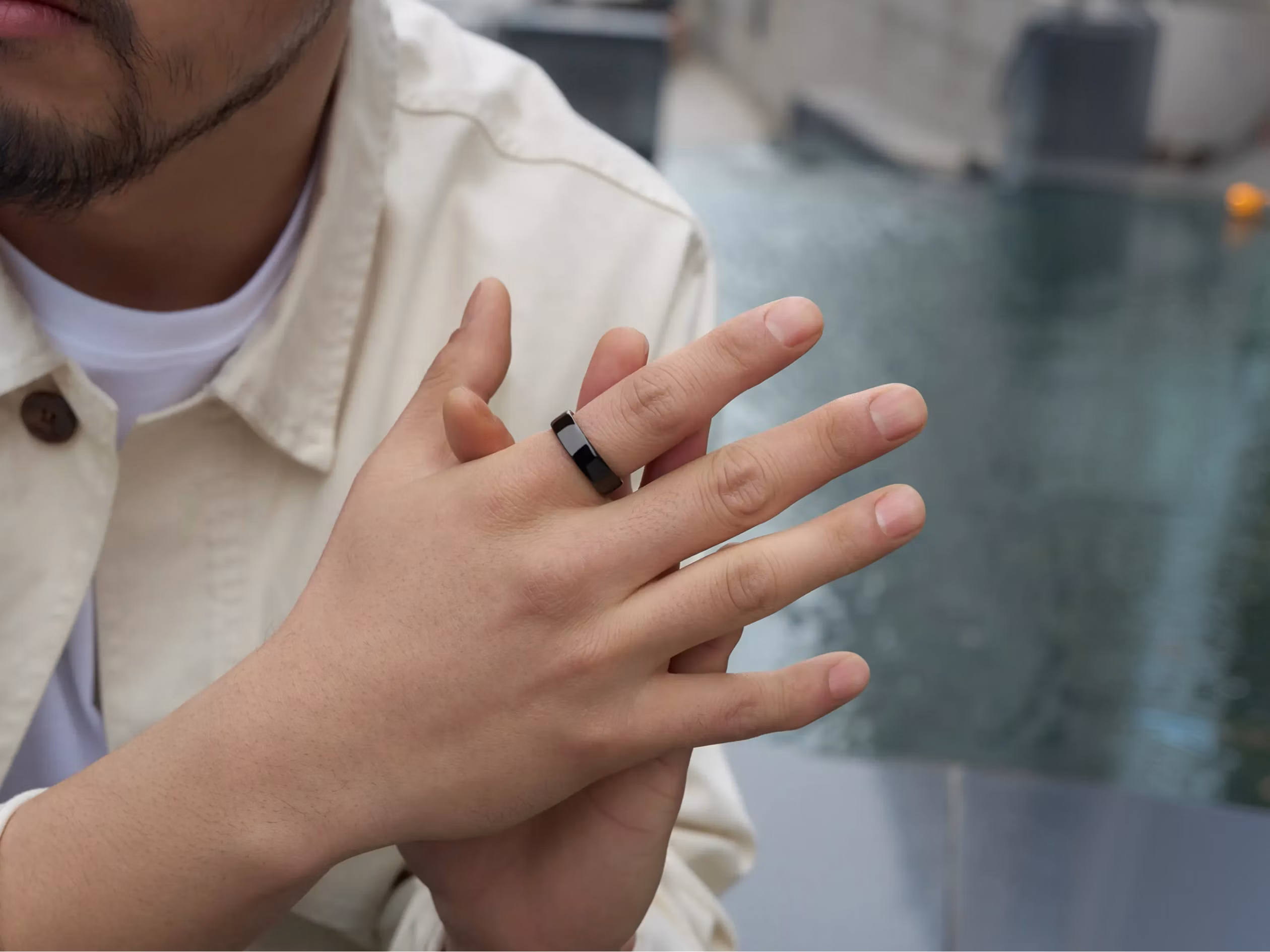 Person relaxing at home in the evening wearing an Oura Ring