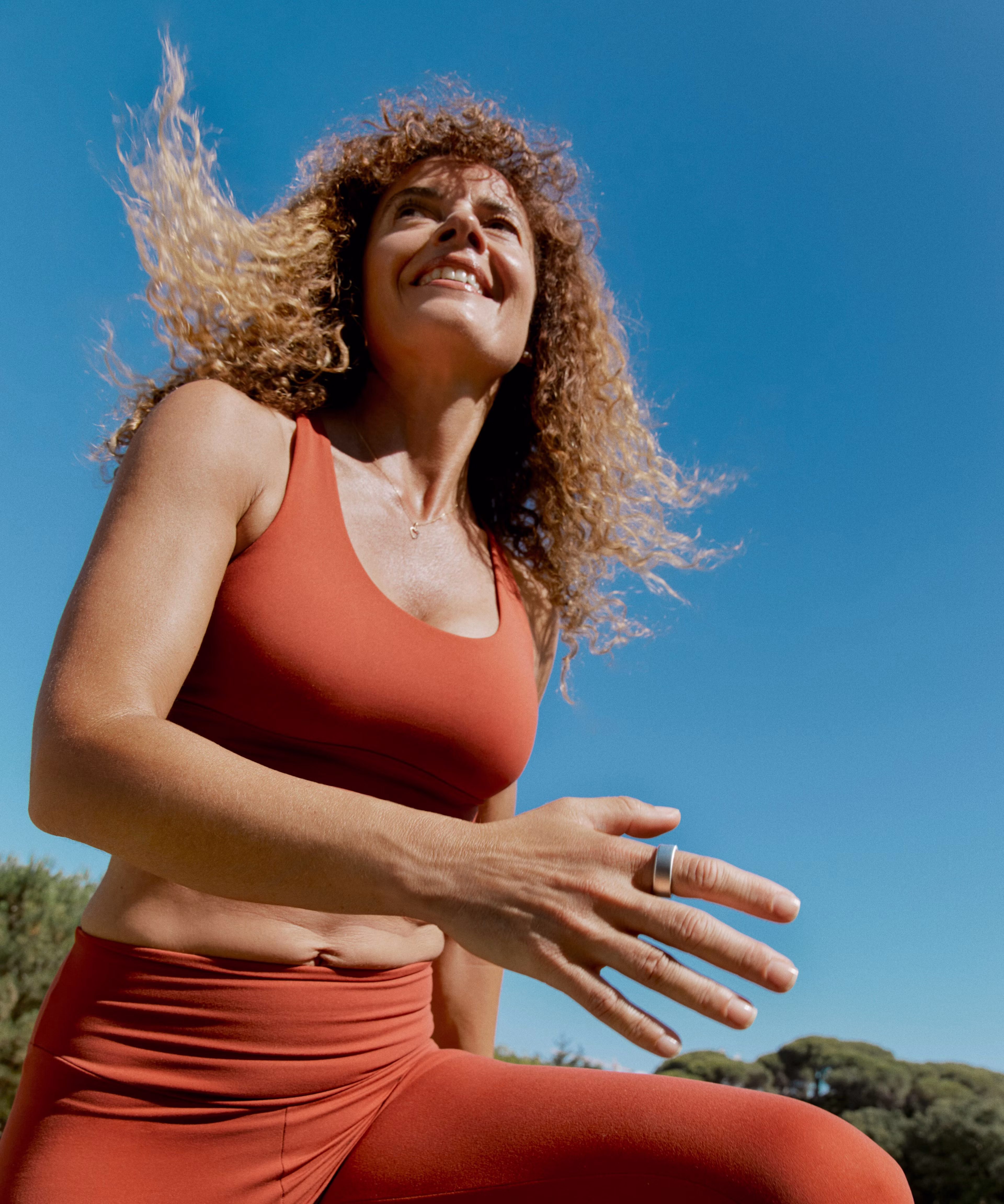 Woman exercising while wearing an Oura ring